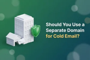Large office building beside a small detached outbuilding with an envelope flying out and a green shield between them, illustrating a separate domain for cold email